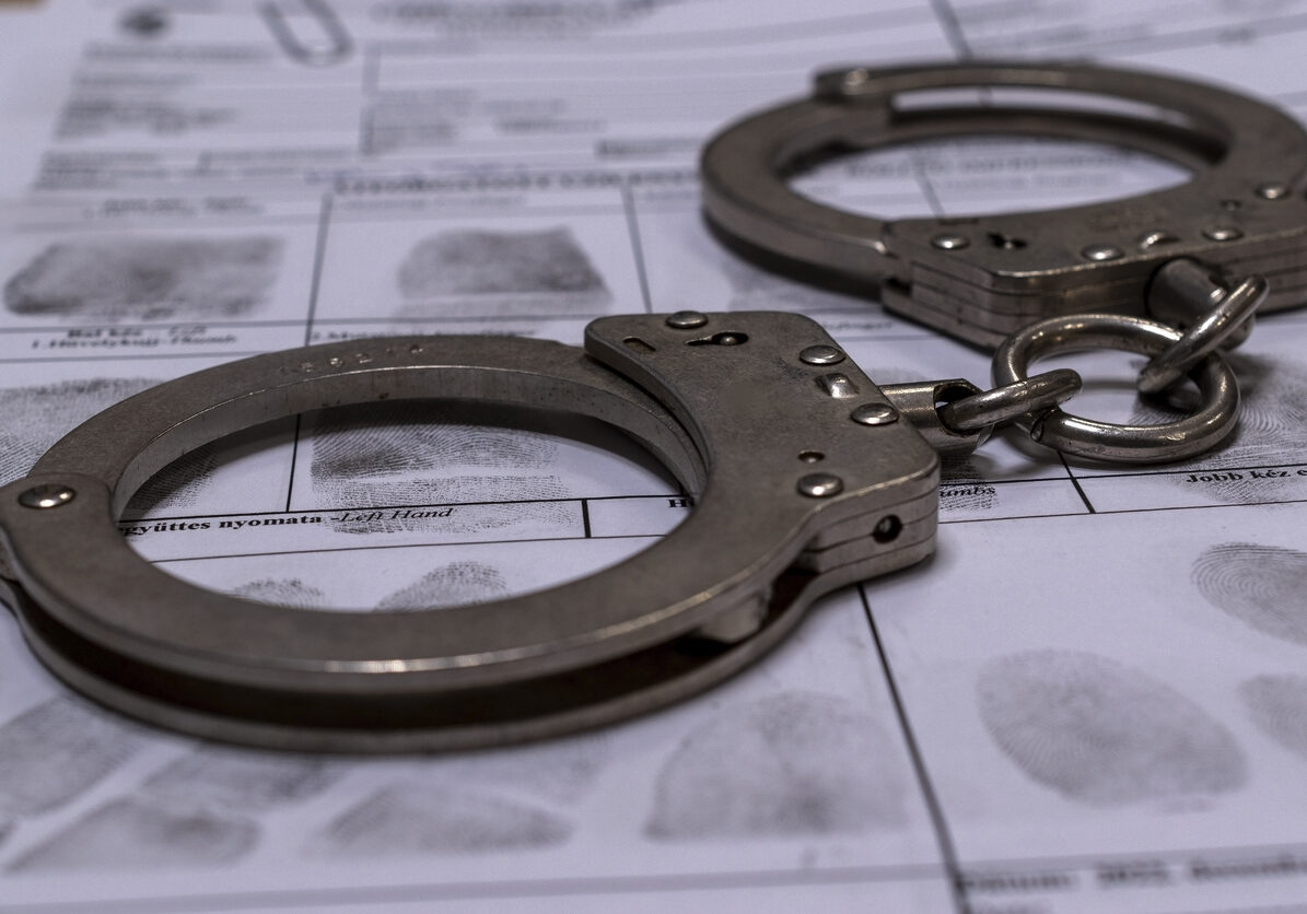 Handcuffs and fingerprint card